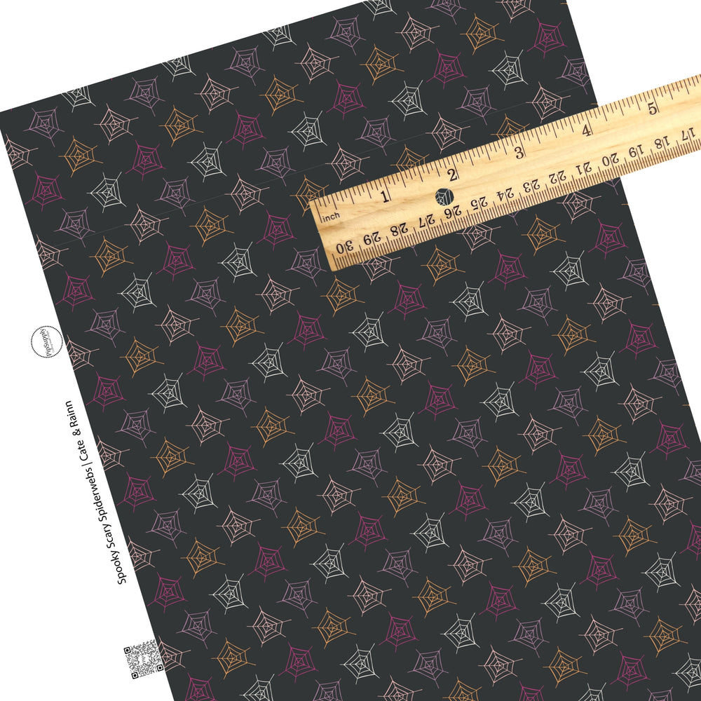 These Halloween themed black faux leather sheets contain the following design elements: white, light pink, dark pink, and orange spiderwebs on black. Our CPSIA compliant faux leather sheets or rolls can be used for all types of crafting projects.