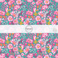 These floral themed teal fabric by the yard features hot pink, orange, aqua, and light pink flowers on teal. This fun summer floral themed fabric can be used for all your sewing and crafting needs! 
