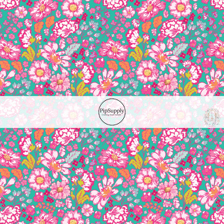 These floral themed teal fabric by the yard features hot pink, orange, aqua, and light pink flowers on teal. This fun summer floral themed fabric can be used for all your sewing and crafting needs! 