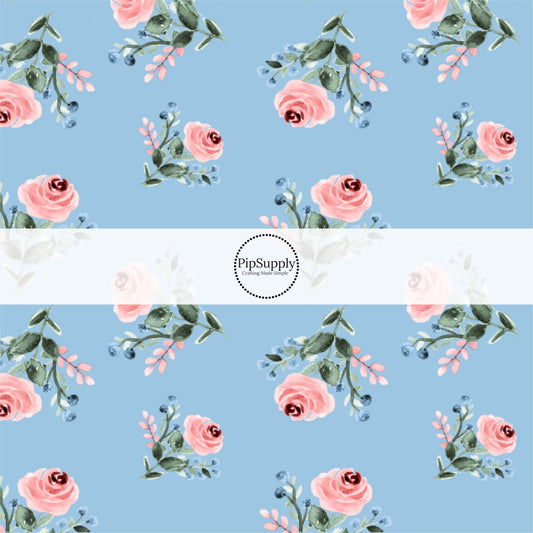 This summer fabric by the yard features pink roses on blue. This fun summer themed fabric can be used for all your sewing and crafting needs!
