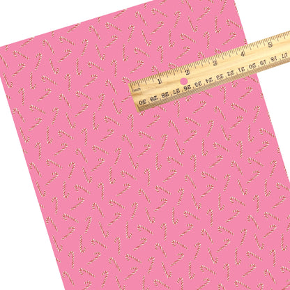 These Christmas themed pattern faux leather sheets contain the following design elements: candy canes on pink. Our CPSIA compliant faux leather sheets or rolls can be used for all types of crafting projects.