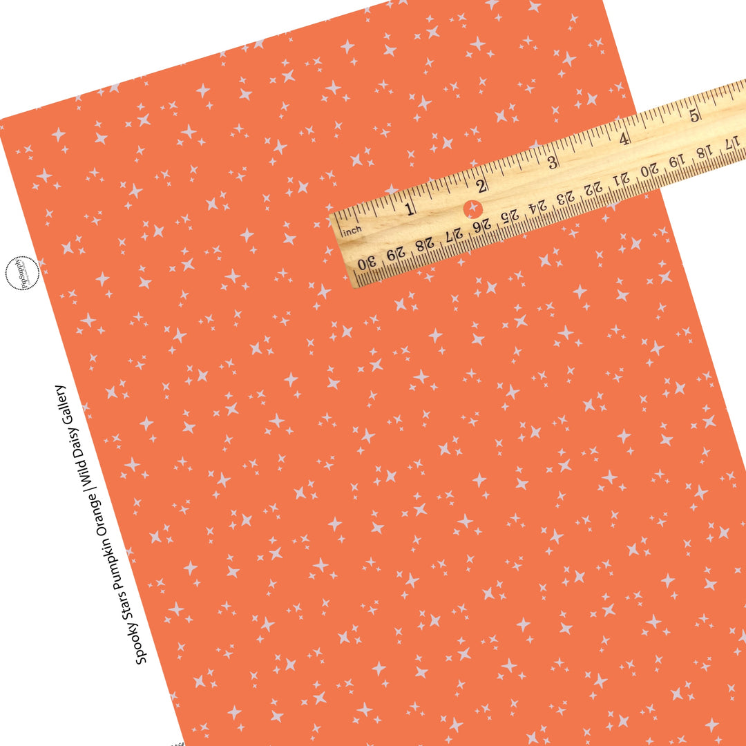 Scattere stars on orange faux leather sheets