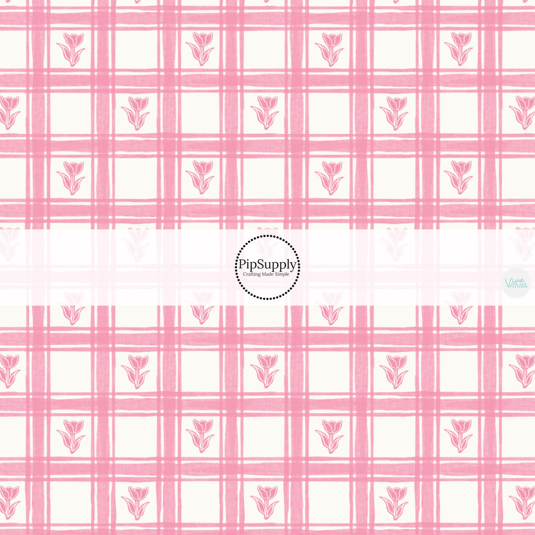 This Easter themed fabric by the yard features pink tulips on a light pink gingham pattern. This fun pattern fabric can be used for all your sewing and crafting needs!