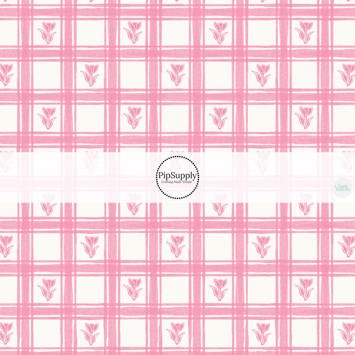 This Easter themed fabric by the yard features pink tulips on a light pink gingham pattern. This fun pattern fabric can be used for all your sewing and crafting needs!