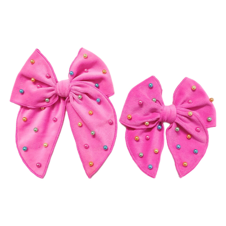 These spring pink velvet pearl tied bows are ready to package and resell to your customers no sewing or measuring necessary! These hair bows come with a alligator clip already attached. Along with pastel multi colored pearls.