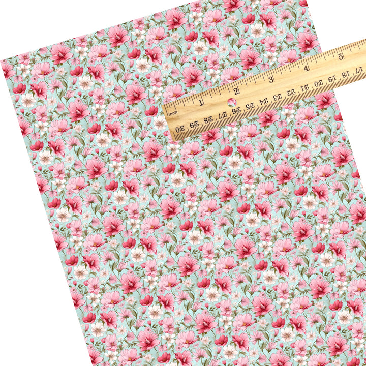 These floral themed faux leather sheets contain the following design elements: pink and cream flowers on blue. Our CPSIA compliant faux leather sheets or rolls can be used for all types of crafting projects.