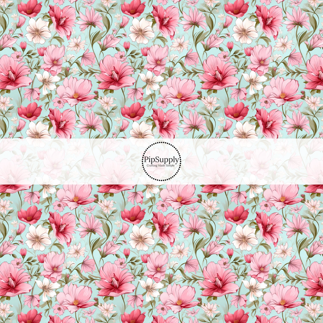 These floral fabric by the yard features pink and cream flowers on blue. This fun pattern fabric can be used for all your sewing and crafting needs!