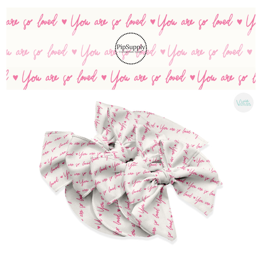 Cursive you are so loved in pink on cream hair bow strips