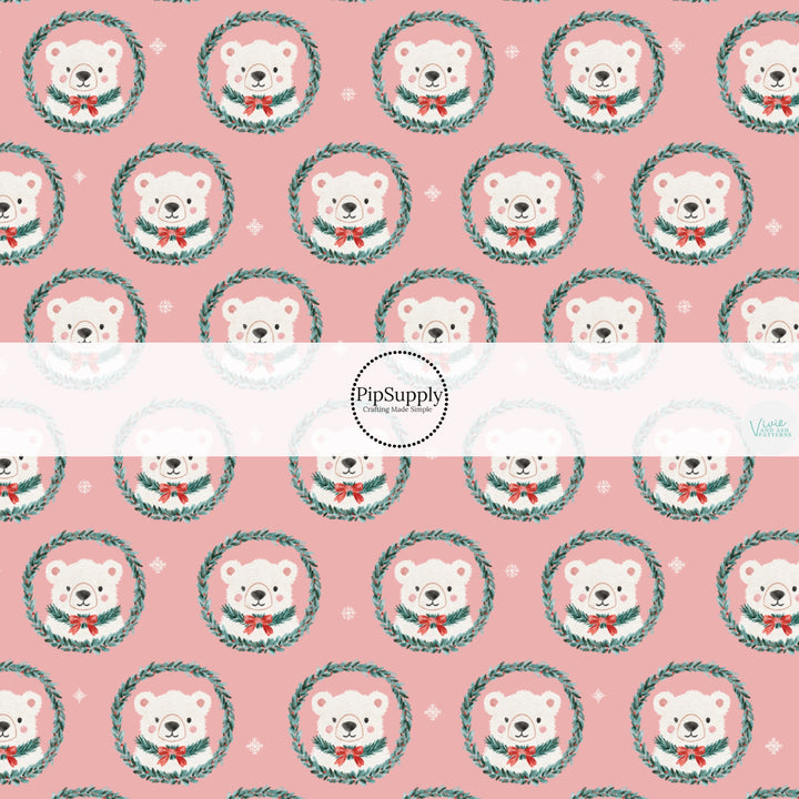 These Christmas themed pattern fabric by the yard features the following design elements: polar bear wreaths on pink. This fun themed fabric can be used for all your sewing and crafting needs!