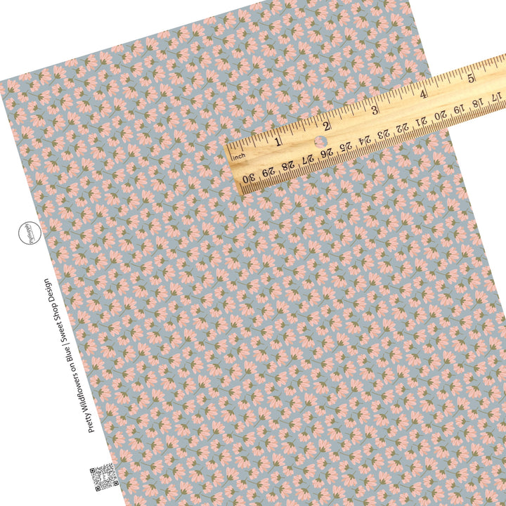 These summer faux leather sheets contain the following design elements: pink wildflowers on blue. Our CPSIA compliant faux leather sheets or rolls can be used for all types of crafting projects.