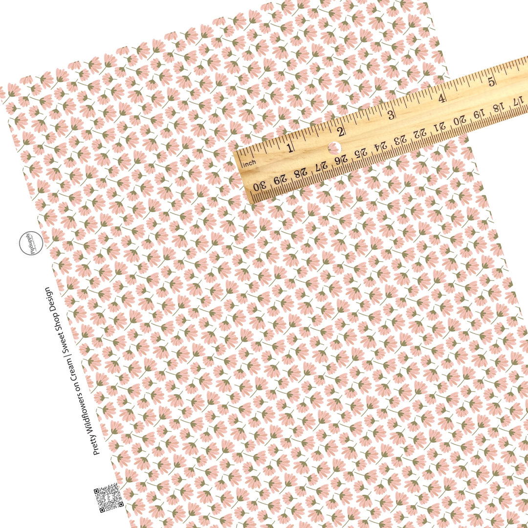 These summer faux leather sheets contain the following design elements: pink wildflowers on white. Our CPSIA compliant faux leather sheets or rolls can be used for all types of crafting projects.