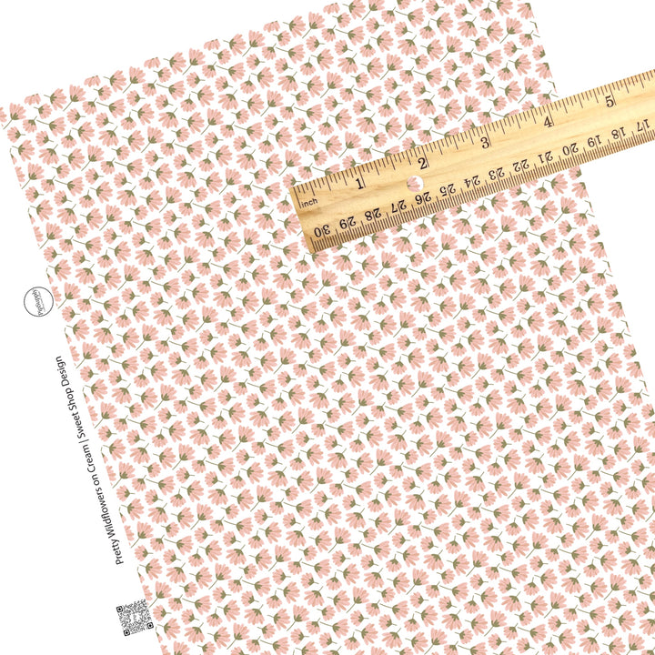 These summer faux leather sheets contain the following design elements: pink wildflowers on white. Our CPSIA compliant faux leather sheets or rolls can be used for all types of crafting projects.