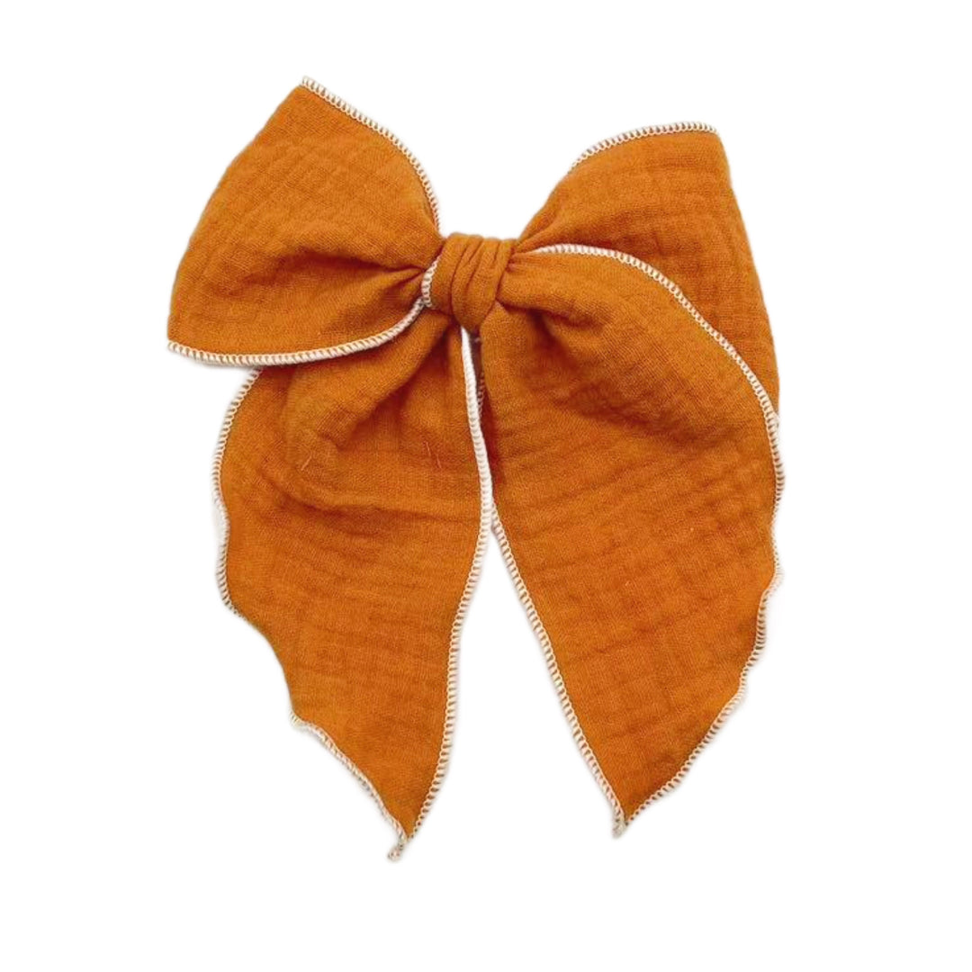 These solid pre-cut tied bows are ready to package and resell to your customers no sewing or measuring necessary! These hair bows come with a clip already attached.