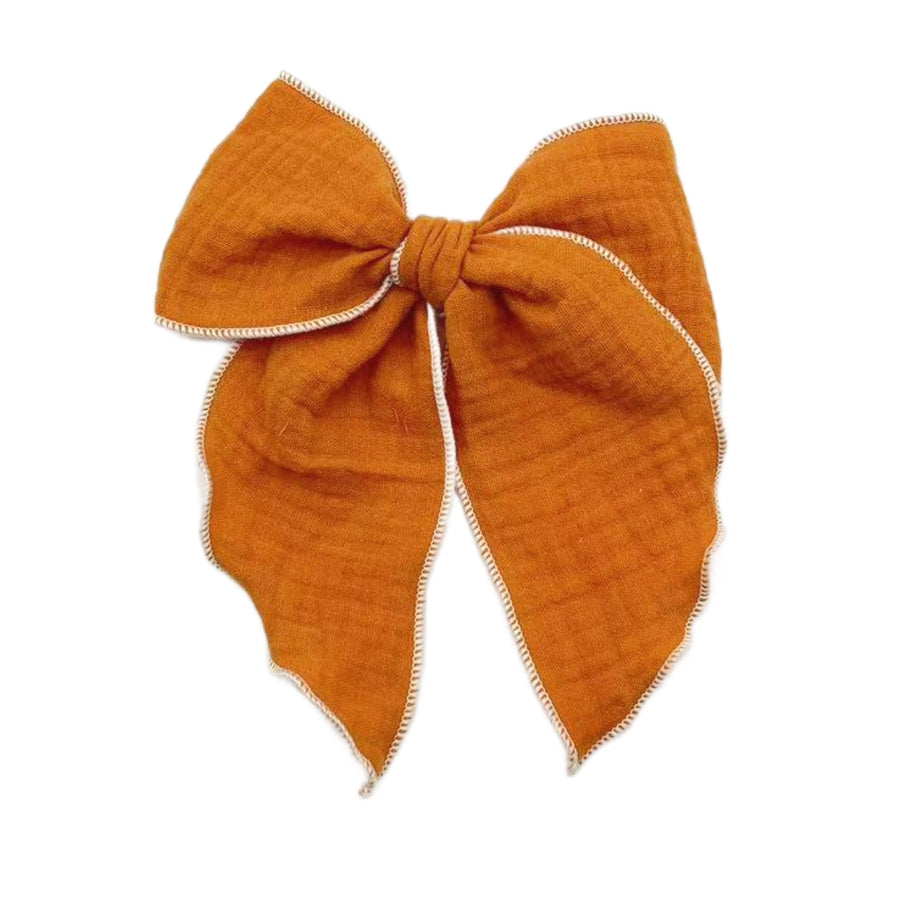 These solid pre-cut tied bows are ready to package and resell to your customers no sewing or measuring necessary! These hair bows come with a clip already attached.