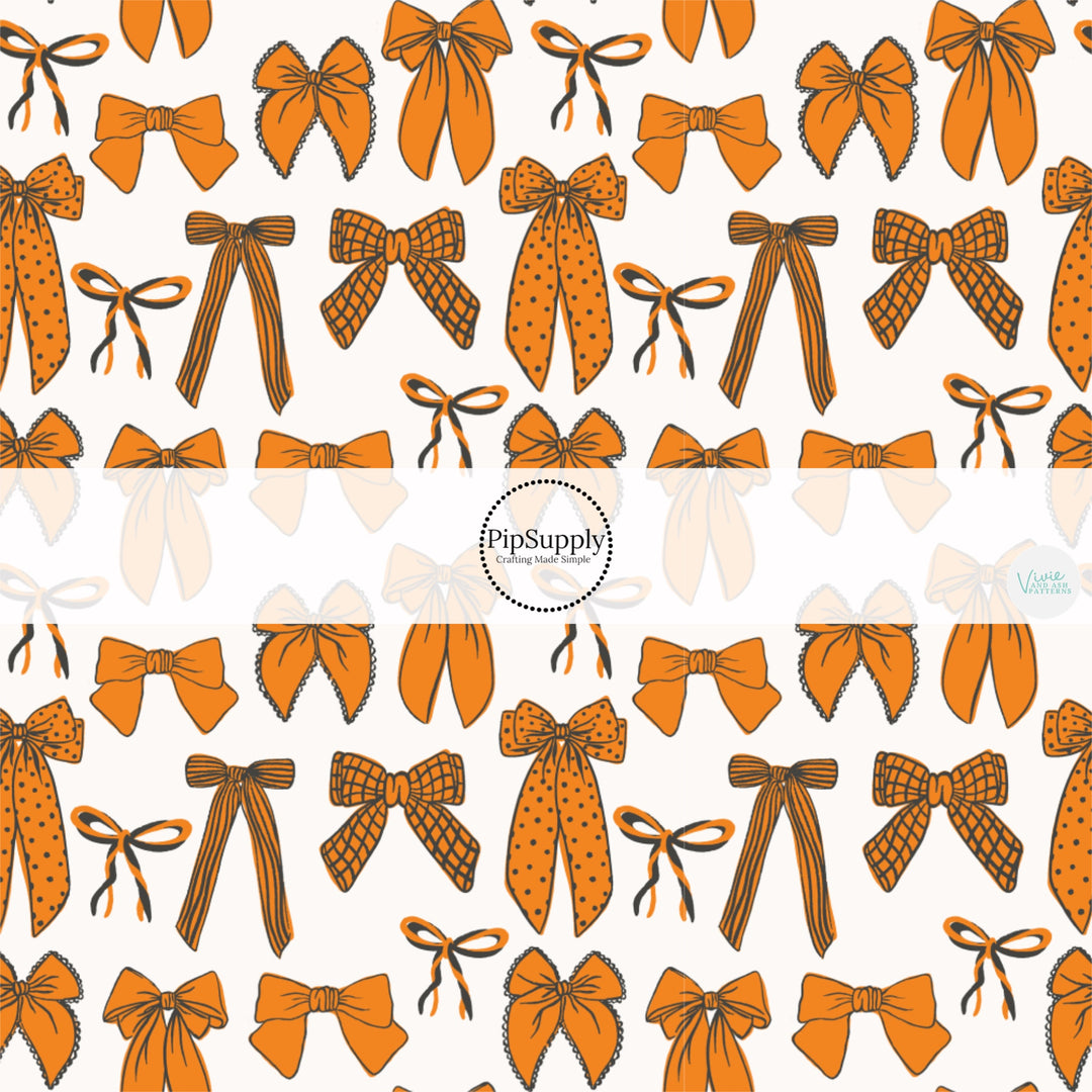 These fall themed pattern fabric by the yard features the following design elements: orange pattern bows on white. This fun themed fabric can be used for all your sewing and crafting needs!