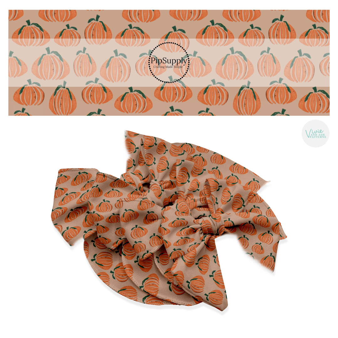 Orange pumpkins on taupe hair bow strips