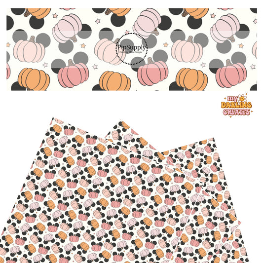 Pink, orange, and purple mouse head pumpkins with stars on cream faux leather sheets