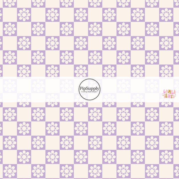 This spring fabric by the yard features daisy flowers on purple and cream checkers. This fun pattern fabric can be used for all your sewing and crafting needs!