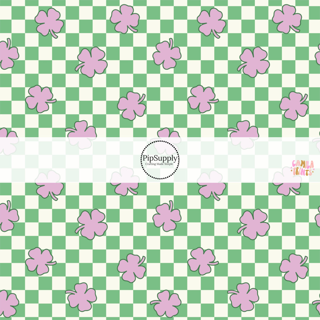 This holiday fabric by the yard features purple cloves on green and cream checkers. This festive pattern fabric can be used for all your sewing and crafting needs!