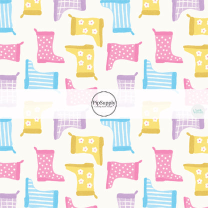 These spring bows themed no sew bow strips can be easily tied and attached to a clip for a finished hair bow. These patterned bow strips are great for personal use or to sell. These bow strips features pastel pink, purple, yellow, and blue rain boots on cream. 