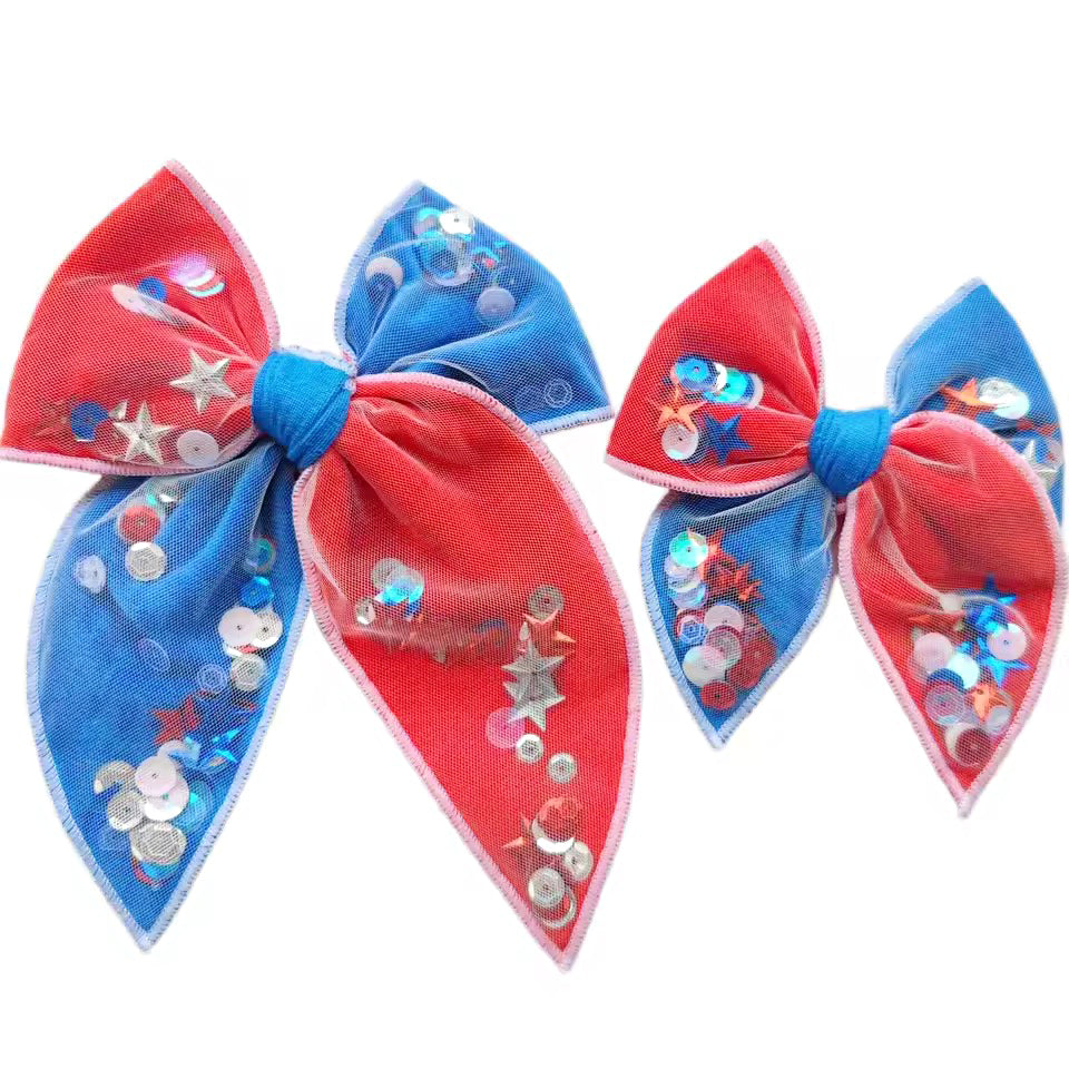 These patriotic red and blue shaker pre-cut tied bows are ready to package and resell to your customers no sewing or measuring necessary! These hair bows come with a clip already attached. The shaker bows come pre-filled with patriotic stars and sequin mix.