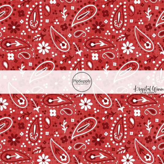These patriotic and western red fabric by the yard features white, red and dark red bandana pattern.