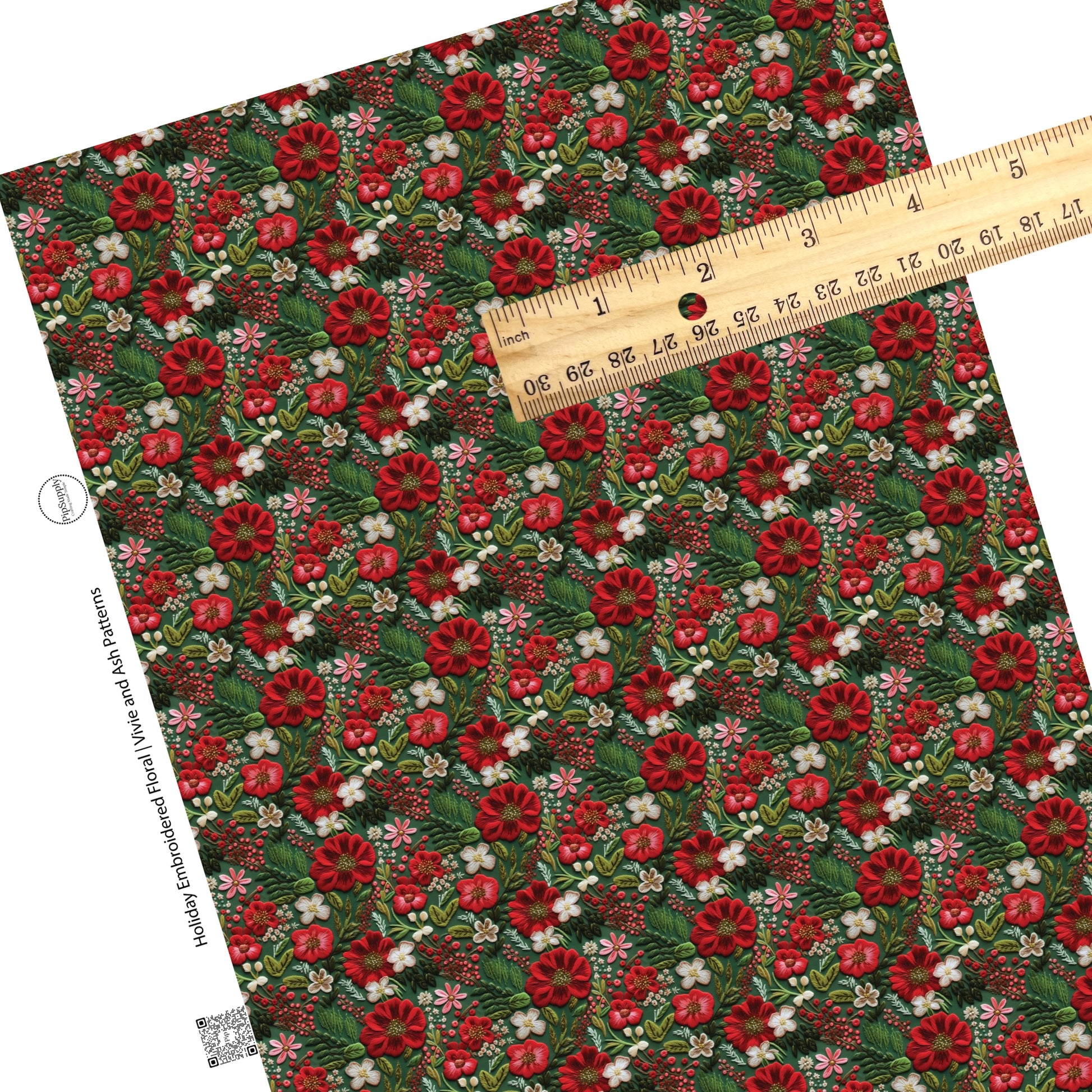 Embroidered christmas flowers on green faux leather sheets