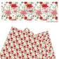 Red, green, and white christmas flowers on white faux leather sheets