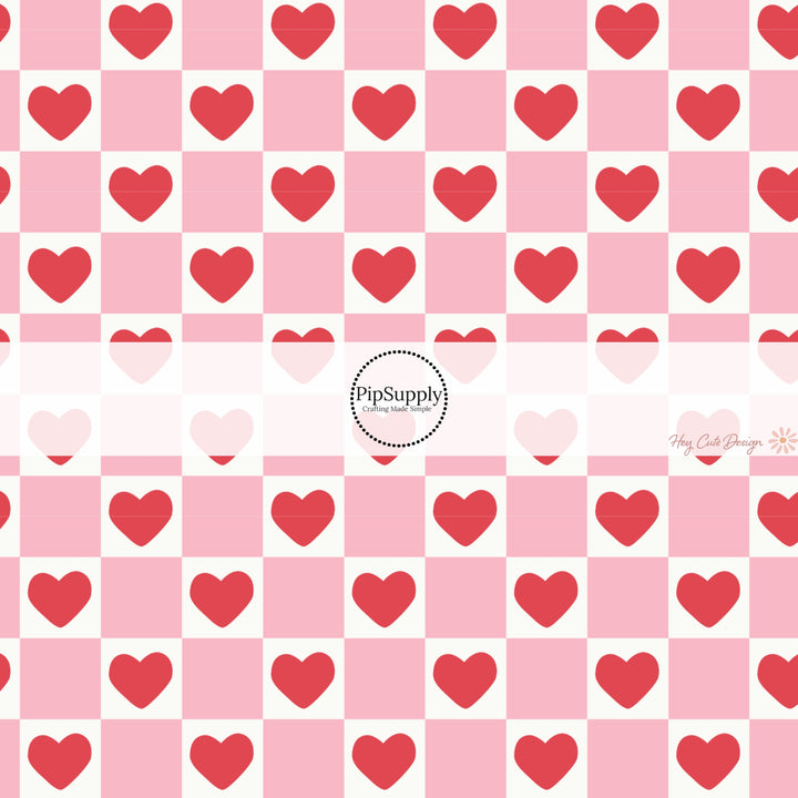 This holiday fabric by the yard features red hearts on pink and cream checkers. This festive pattern fabric can be used for all your sewing and crafting needs!