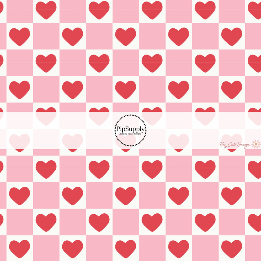 This holiday fabric by the yard features red hearts on pink and cream checkers. This festive pattern fabric can be used for all your sewing and crafting needs!