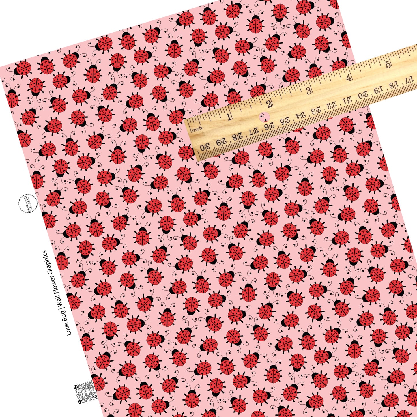 Scattered lady bugs on pink faux leather sheets