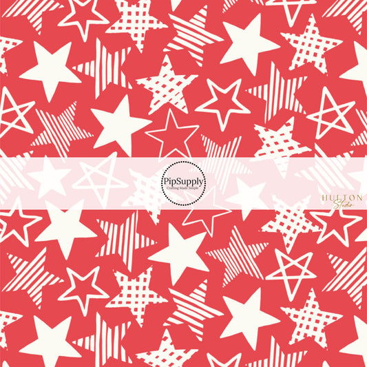 This 4th of July fabric by the yard features patriotic white patterned stars on red. This fun patriotic themed fabric can be used for all your sewing and crafting needs!
