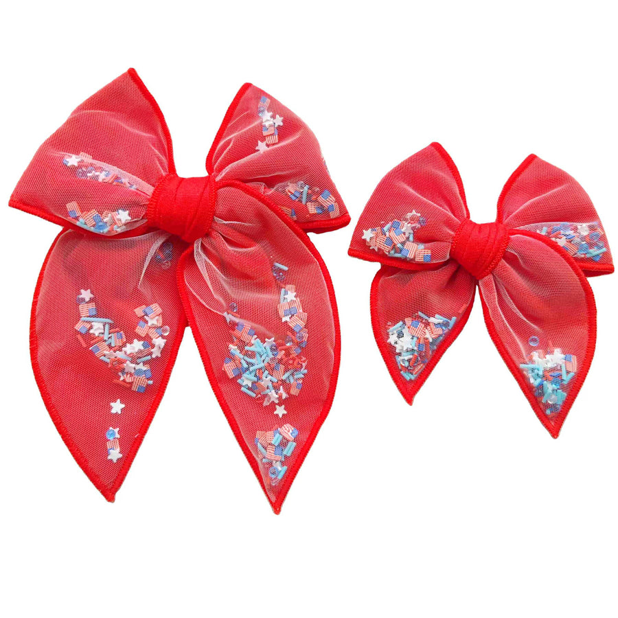 These patriotic red shaker pre-cut tied bows are ready to package and resell to your customers no sewing or measuring necessary! These hair bows come with a clip already attached. The shaker bows come pre-filled with patriotic stars, American flag, and sprinkle clay mix.