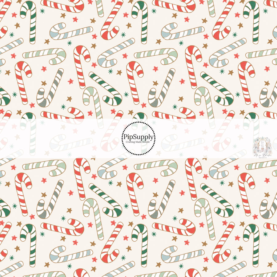 These Christmas themed pattern fabric by the yard features the following design elements: candy canes on cream. This fun themed fabric can be used for all your sewing and crafting needs!