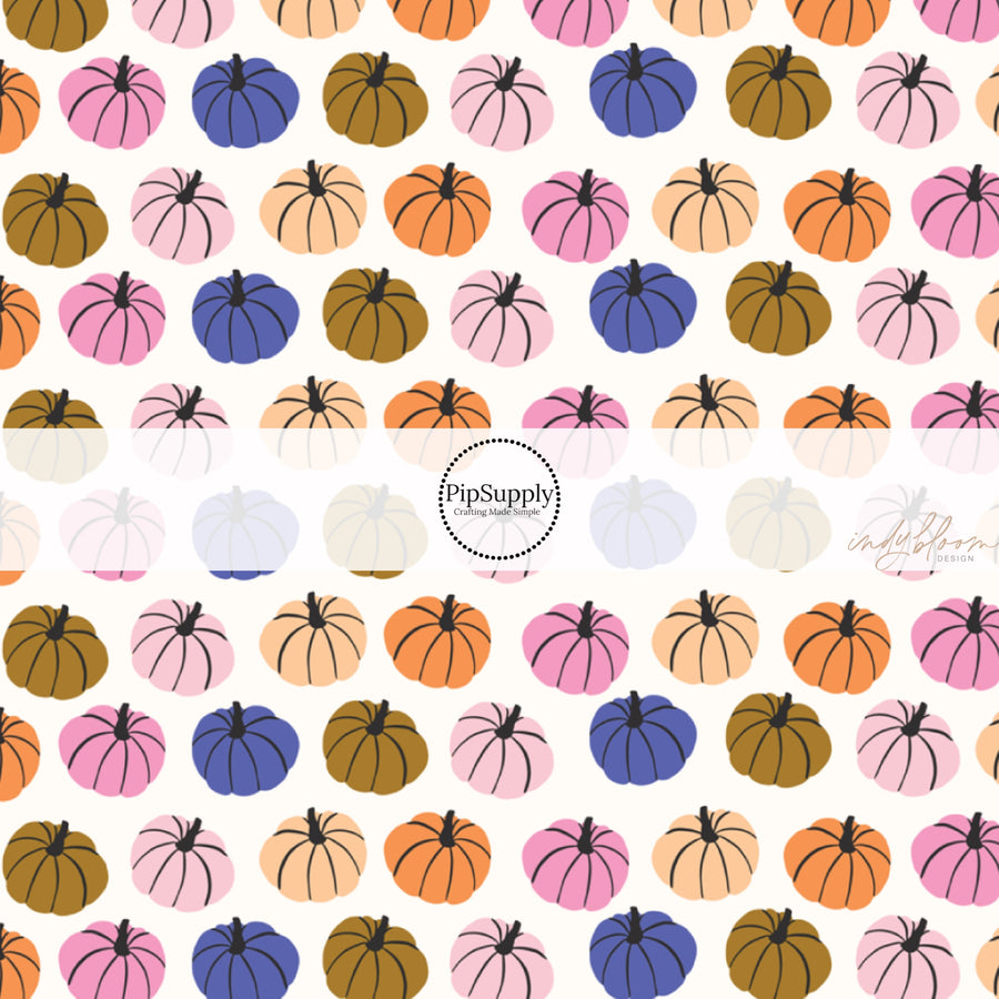 These Halloween themed pattern fabric by the yard features the following design elements: multi colored pumpkins on cream. This fun spooky themed fabric can be used for all your sewing and crafting needs!