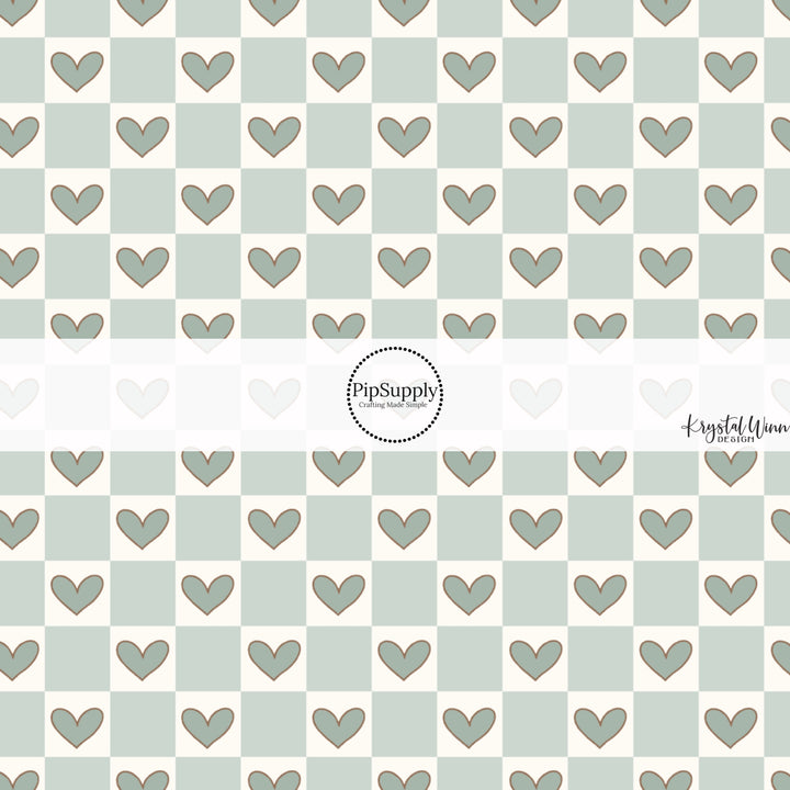 This Valentine's Day themed fabric by the yard features light blue checker pattern with hearts. This fun pattern fabric can be used for all your sewing and crafting needs!