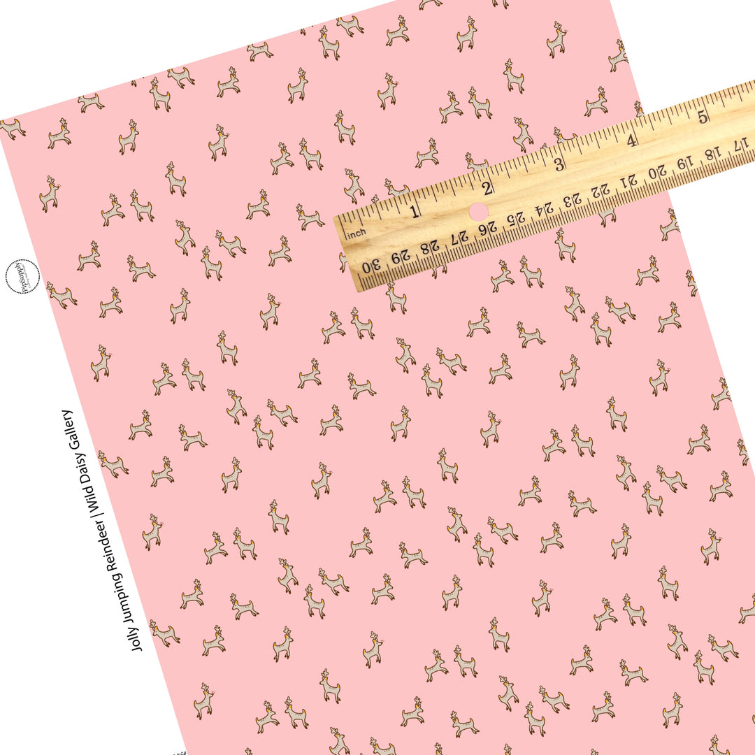 Tiny jumping reindeer on pink faux leather sheet