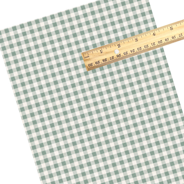 These winter plaid themed pattern faux leather sheets contain the following design elements: sage gingham pattern. Our CPSIA compliant faux leather sheets or rolls can be used for all types of crafting projects.