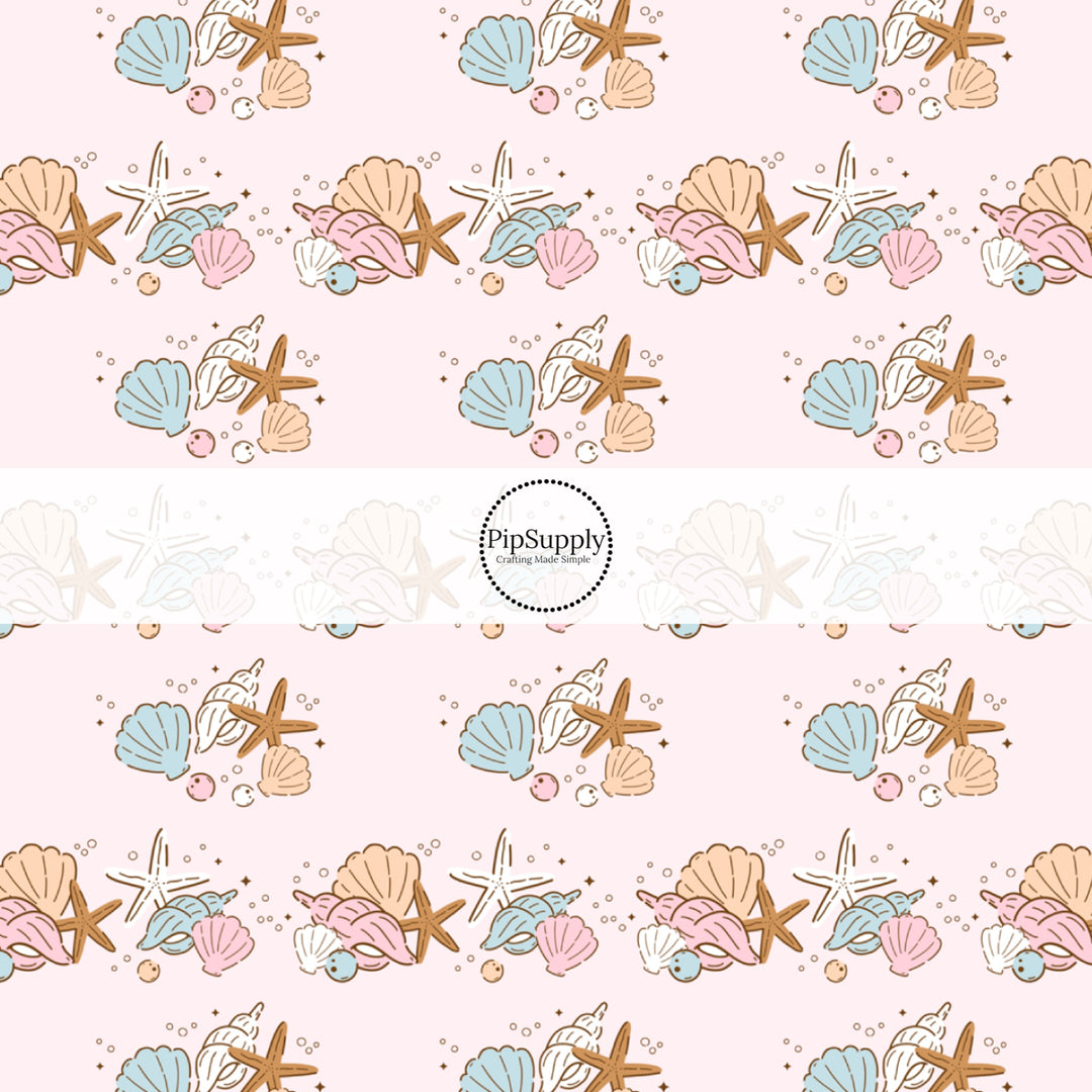 This beach fabric by the yard features seashells on light pink. This fun summer themed fabric can be used for all your sewing and crafting needs!