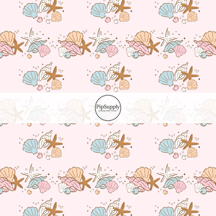 This beach fabric by the yard features seashells on light pink. This fun summer themed fabric can be used for all your sewing and crafting needs!