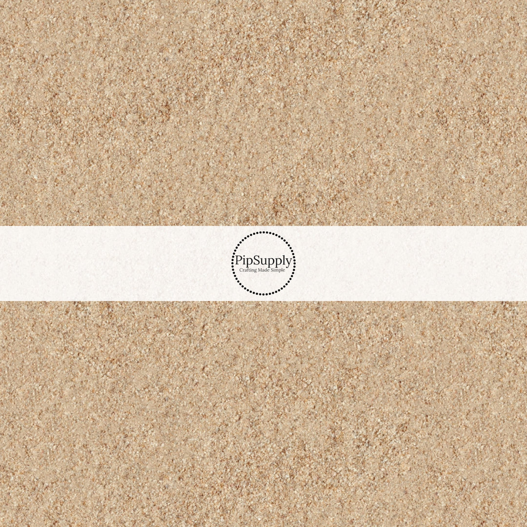 These beach themed fabric by the yard features beach sand. This fun pattern fabric can be used for all your sewing and crafting needs!
