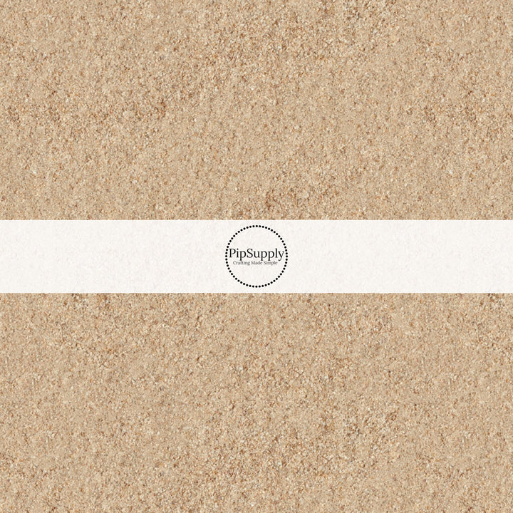 These beach themed fabric by the yard features beach sand. This fun pattern fabric can be used for all your sewing and crafting needs!
