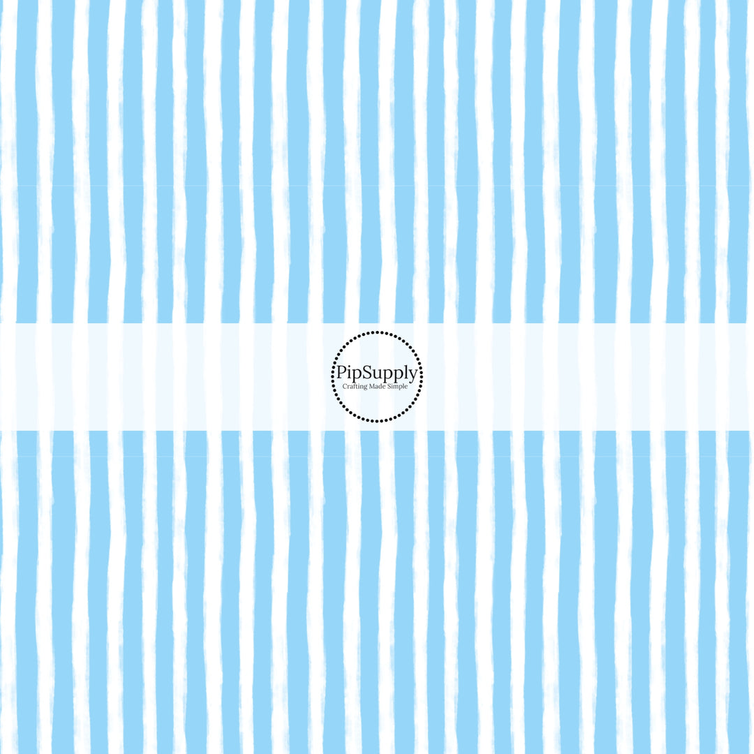 These Santa themed pattern fabric by the yard features the following design elements: blue and white Christmas stripes. This fun themed fabric can be used for all your sewing and crafting needs!