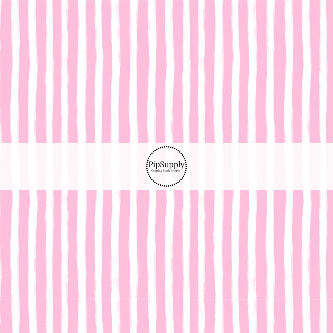 These Santa themed pattern fabric by the yard features the following design elements: pink and white Christmas stripes. This fun themed fabric can be used for all your sewing and crafting needs!