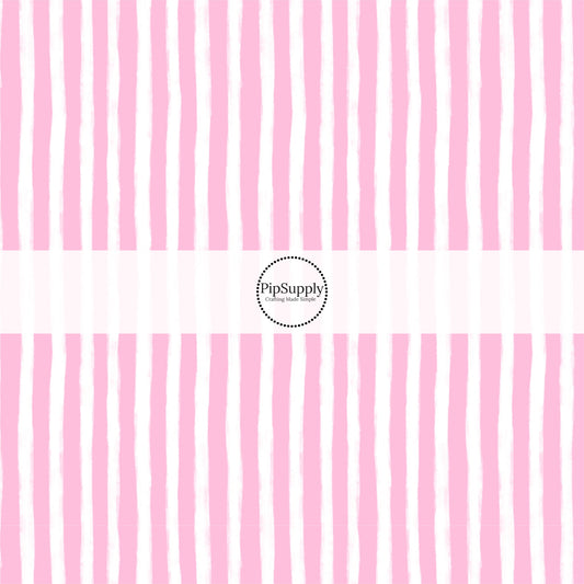 These Santa themed pattern fabric by the yard features the following design elements: pink and white Christmas stripes. This fun themed fabric can be used for all your sewing and crafting needs!