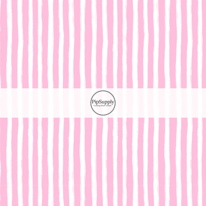 These Santa themed pattern fabric by the yard features the following design elements: pink and white Christmas stripes. This fun themed fabric can be used for all your sewing and crafting needs!