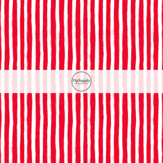 These Santa themed pattern fabric by the yard features the following design elements: red and white Christmas stripes. This fun themed fabric can be used for all your sewing and crafting needs!