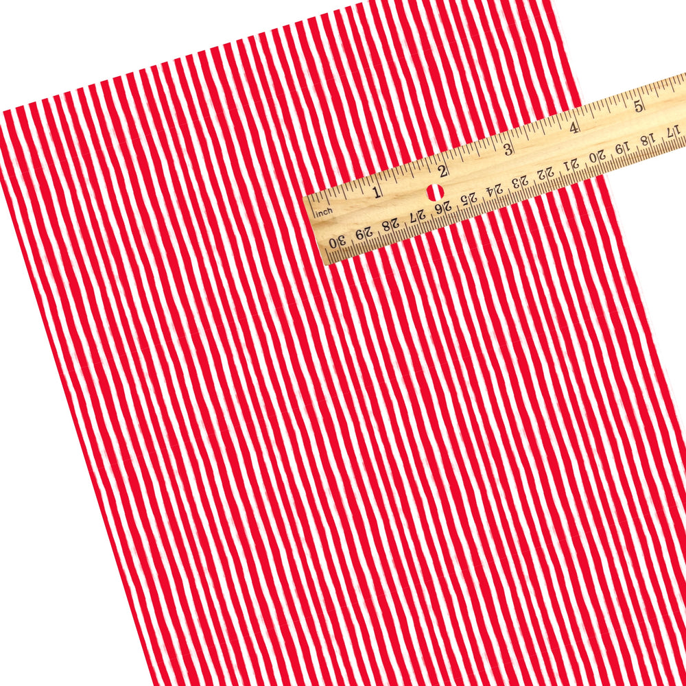 These Santa themed pattern faux leather sheets contain the following design elements: red and white Christmas stripes. Our CPSIA compliant faux leather sheets or rolls can be used for all types of crafting projects.