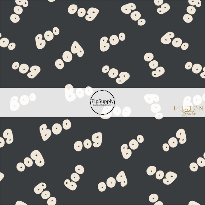 These Halloween themed pattern fabric by the yard features the following design elements: cream "BOO" on black. This fun spooky themed fabric can be used for all your sewing and crafting needs!