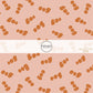 These Halloween themed pattern fabric by the yard features the following design elements: orange "BOO" on light pink. This fun spooky themed fabric can be used for all your sewing and crafting needs!